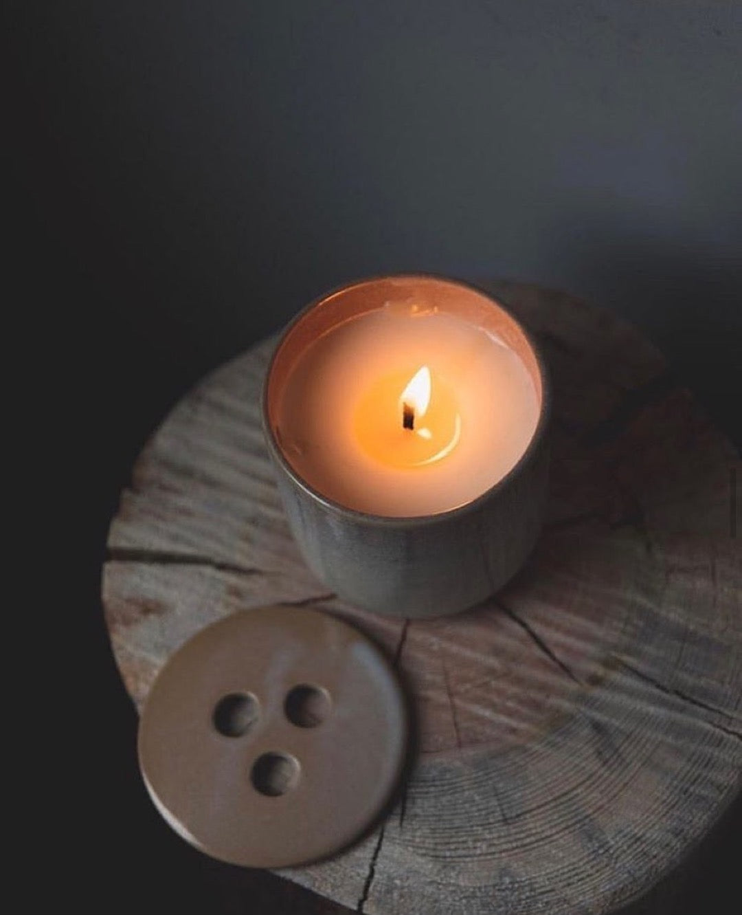 Nordic living with simple design, grey and beige neutral tones and scented candle Hygge from Skandinavisk