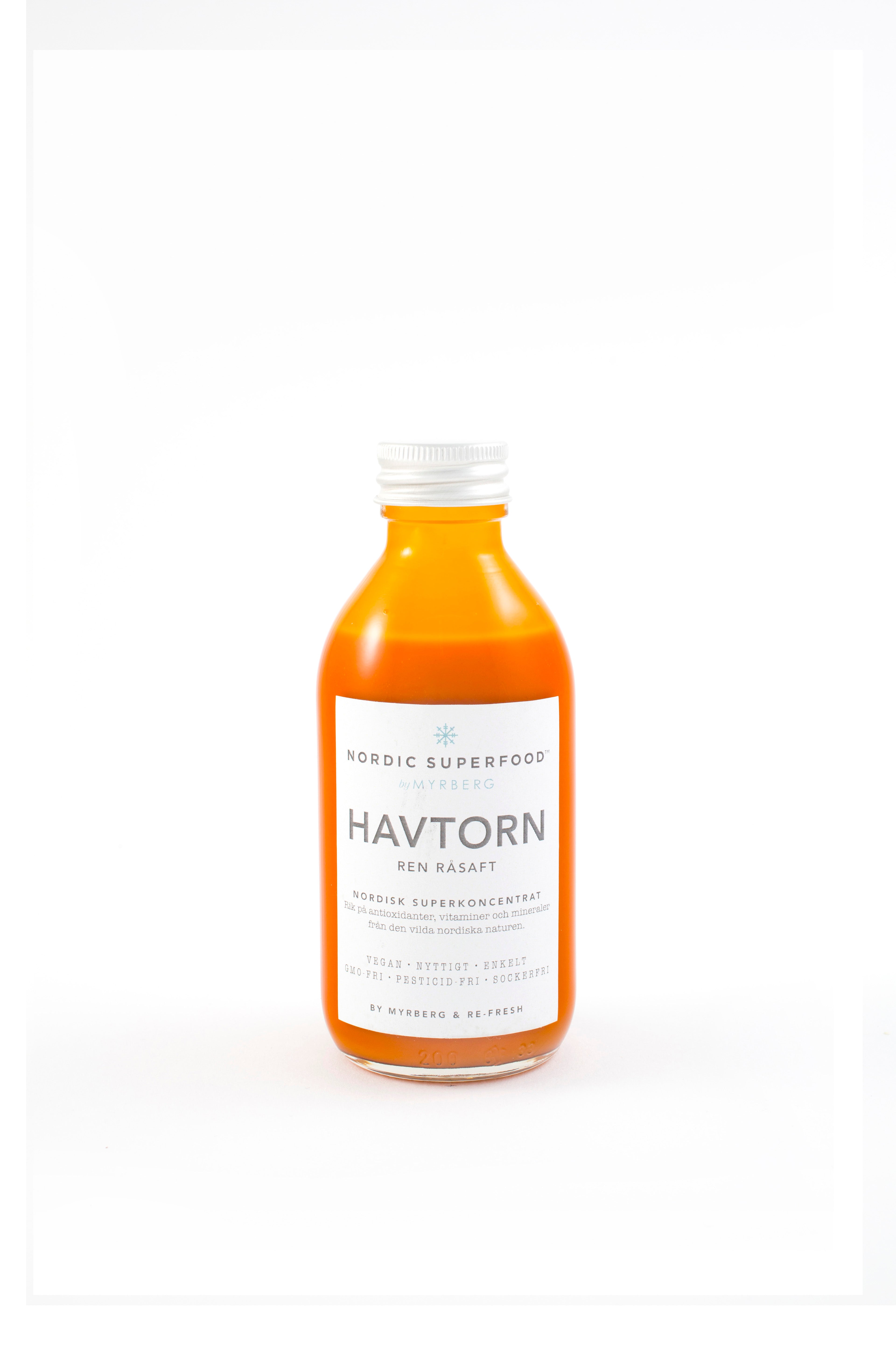 Glass bottle of pure, concentrated raw pressed sea buckthorn health shot from Nordic Superfoods