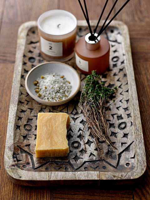 Pretty scented candle in soft toned glass jar for Nordic home style from Bloomingville