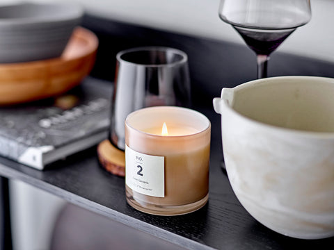 Pretty scented candle in soft toned glass jar for Nordic home style from Bloomingville