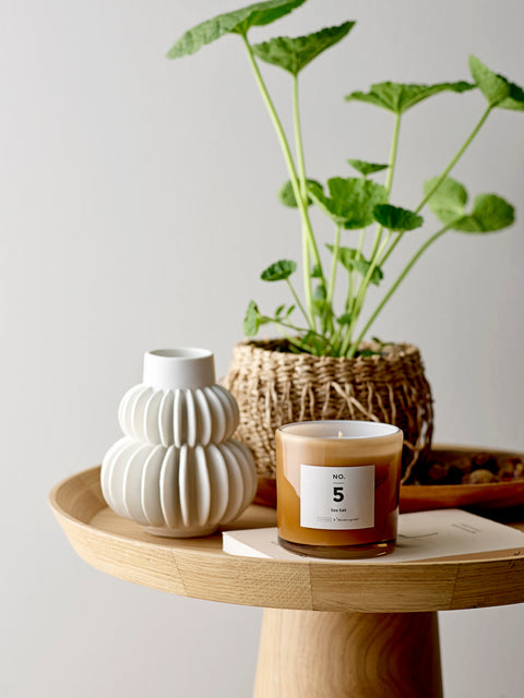Pretty scented candle in soft toned glass jar for Nordic home style from Bloomingville