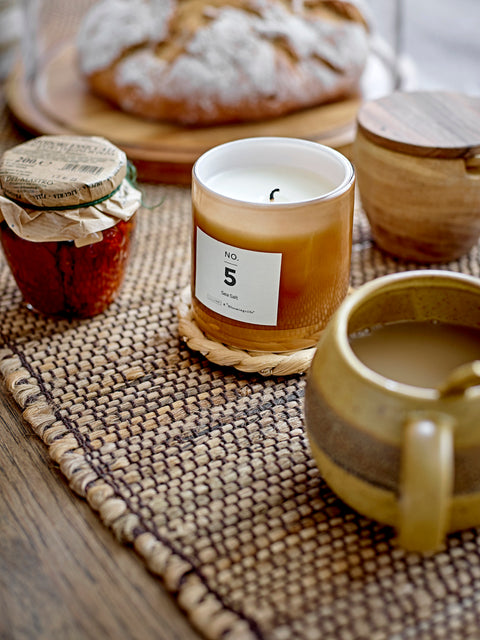 Pretty scented candle in soft toned glass jar for Nordic home style from Bloomingville