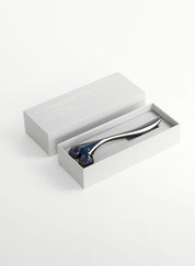 Steel coloured metal sculpting tool with faceted rollers to improve skin tone and circulation, boosting collagen production and for home facial treatments is a great luxury gift for the skincare junkie from Woods Copenhagen. (8544846676273)