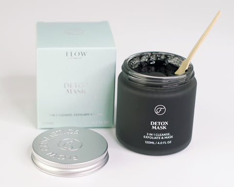 Black charcoal face mask from Flow Cosmetics is an organic home treatment to cleanse, exfoliate and detox the skin