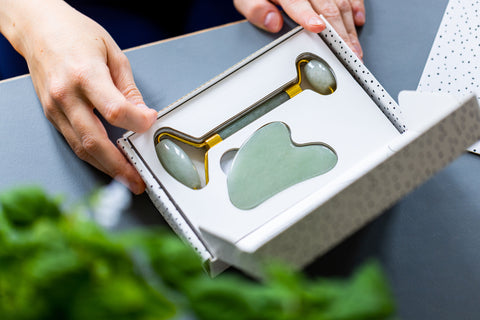 Grums jade gua sha and roller in a gift box for a lovely beauty gift item to create a home ritual that benefits skin tone and drainage.