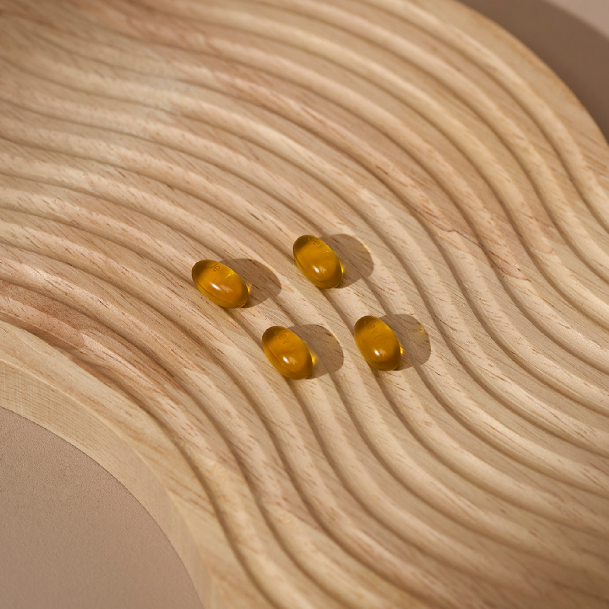 Capsules of Jevie Omega 3-5-6-7-9 supplement, clean plant-based formulation of omega fatty acids for skin and wellness