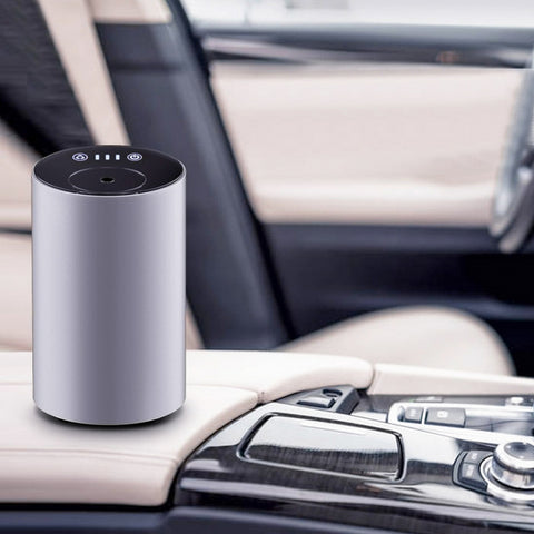 Modern white portable essential oil diffuser, ideal to use in the car, at your desk or anywhere without the need for a cable or wall outlet. No water - simply screw in the essential oil 10ml bottle.