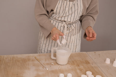Making ceramic candle holders in large and small sizes with choice of glaze colours, to hold thin beeswax taper candles from Ovo Things