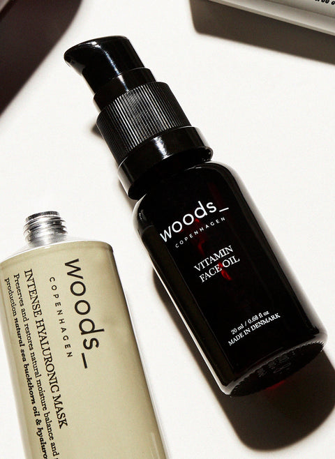 a multi vitamin and antioxidant boost to the skin with natural, organic vegan Vitamin face Oil in its brown pump bottle, ideal for all skins, unisex , made by Woods Copenhagen