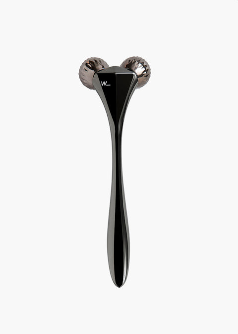 Steel coloured metal sculpting tool with faceted rollers to improve skin tone and circulation, boosting collagen production and for home facial treatments is a great luxury gift for the skincare junkie from Woods Copenhagen.
