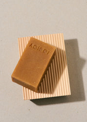Minimalist Hinoki wood soap rest on a neutral background, with natural Aoidoi soap bar sustainably hand crafted for classic bathroom style.