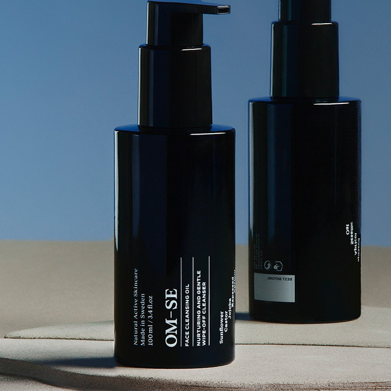 Minimalist collection of natural vegan skincare in stark black and white from Sweden's OM-SE