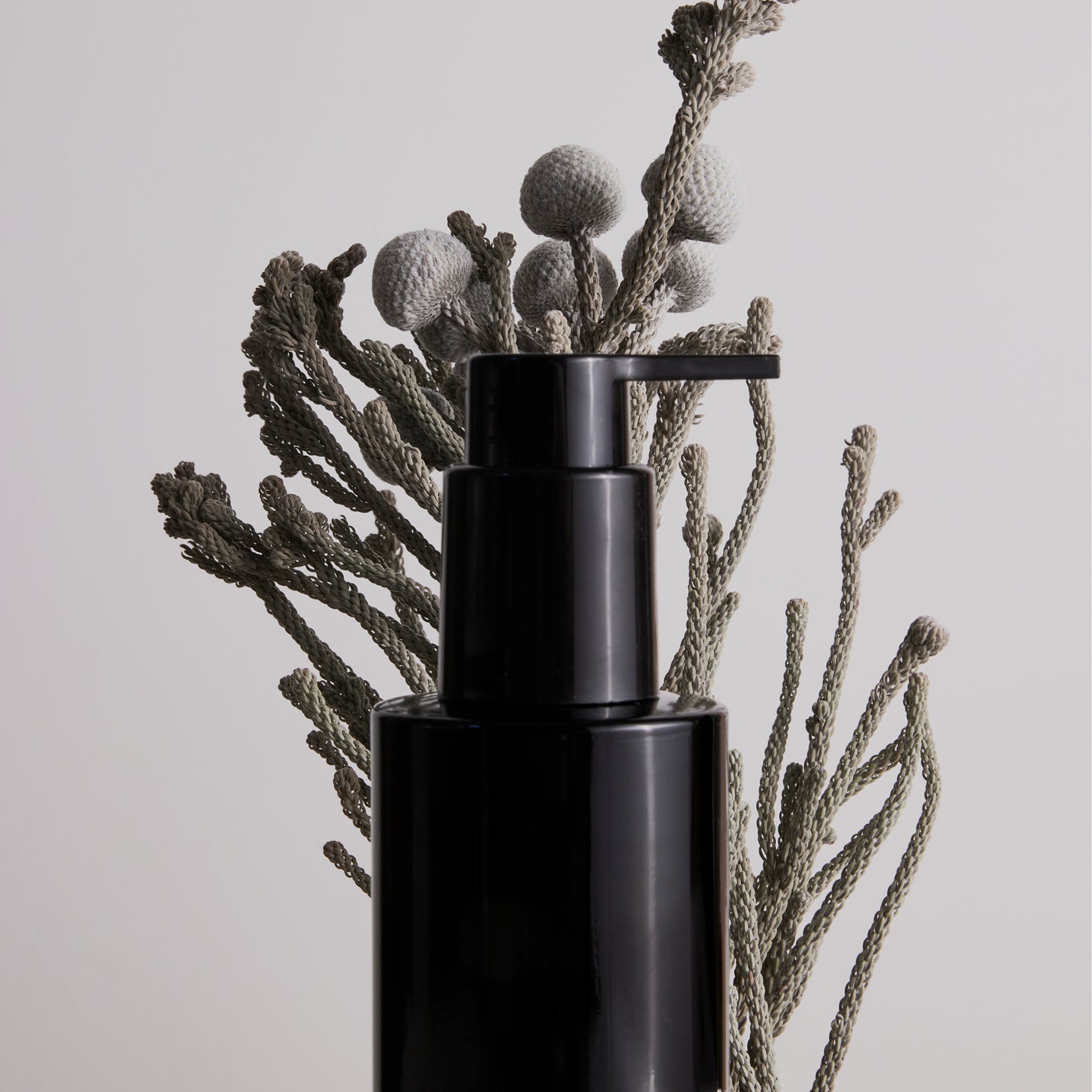 Minimalist collection of natural vegan skincare in stark black and white from Sweden's OM-SE