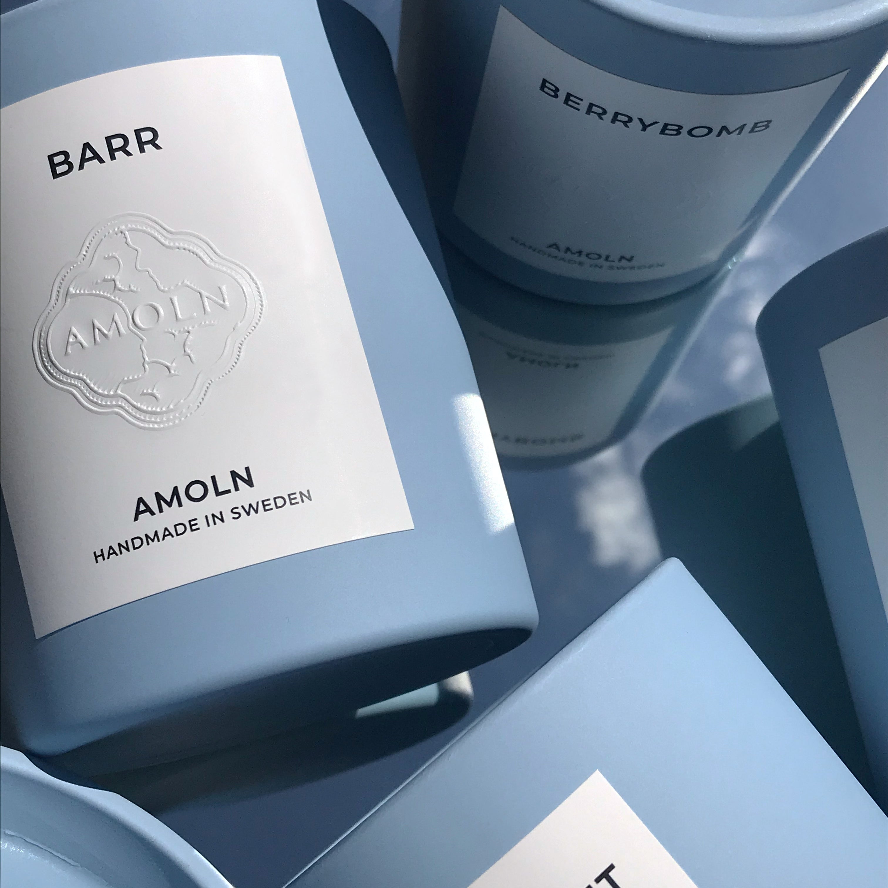 Signature blue candle in the same sky blue ceramic jar, inspired by Scandinavian skies, with luxurious scents of complex citrus, florals and woods from Amoln, makers of Sweden's royal candles.