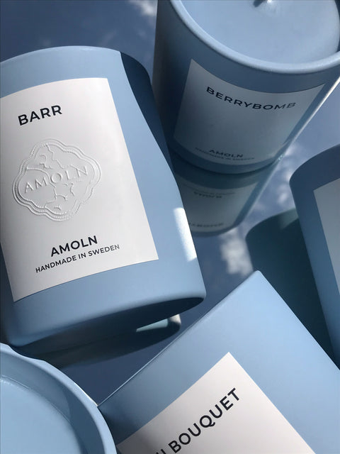 Signature blue candle in the same sky blue ceramic jar, inspired by Scandinavian skies, with luxurious scents of complex citrus, florals and woods from Amoln, makers of Sweden's royal candles.