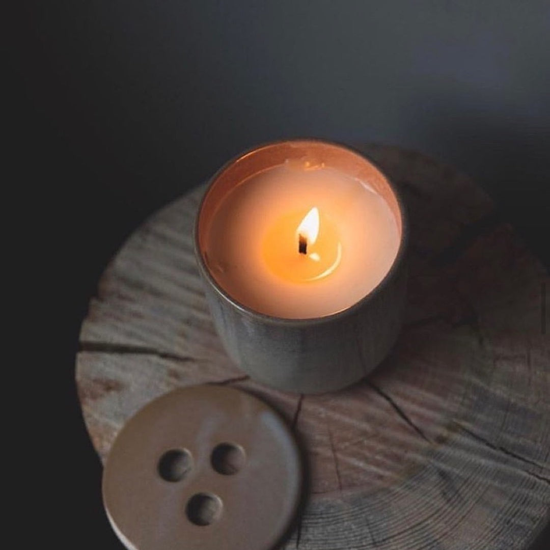 Nordic living with simple design, grey and beige neutral tones and scented candle Hygge from Skandinavisk 