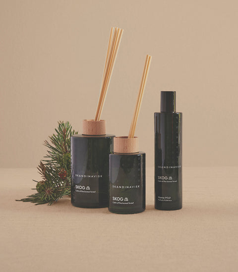 SKOG forest scent  in an organic vegan room fragrance collection in dark green coloured glass jars for the best in Nordic home style from Skandinavisk