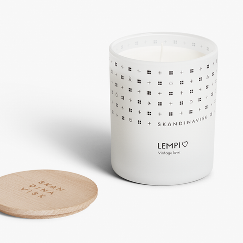 Lempi Organic vegan floral scented candle in soft matt white glass jar with wooden lid for Nordic home style from Skandinavisk. Perfect for valentines or gifts for the one you love.