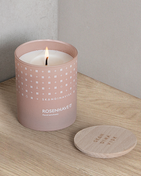 Rosenhave, organic vegan rose-scented candle in soft pink toned glass jar with wooden lid for Nordic home style from Skandinavisk