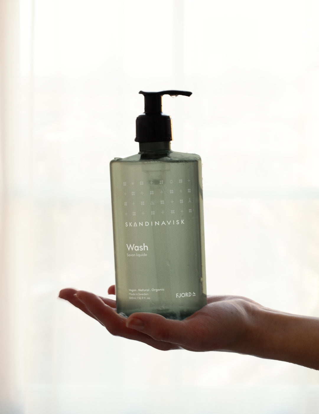 Sustainable, organic & vegan liquid soap, hand wash FJORD, from Skandinavisk in a new clear green pump bottle