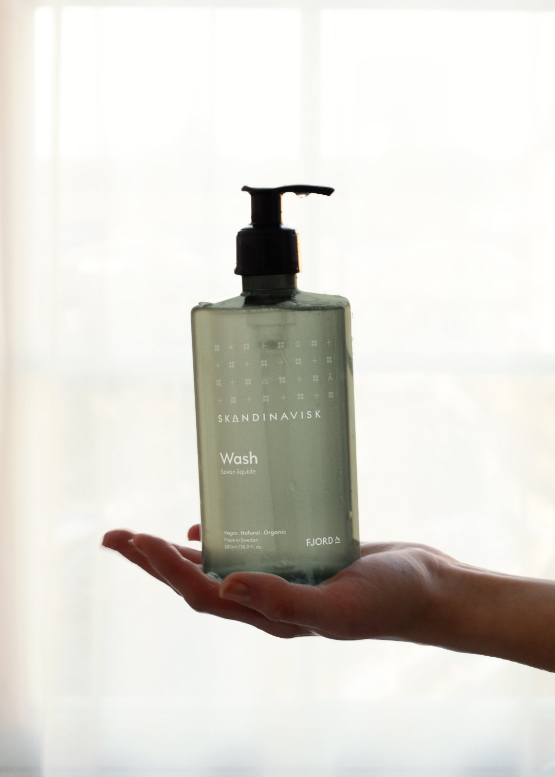 Sustainable, organic & vegan liquid soap, hand wash FJORD, from Skandinavisk in a new clear green pump bottle