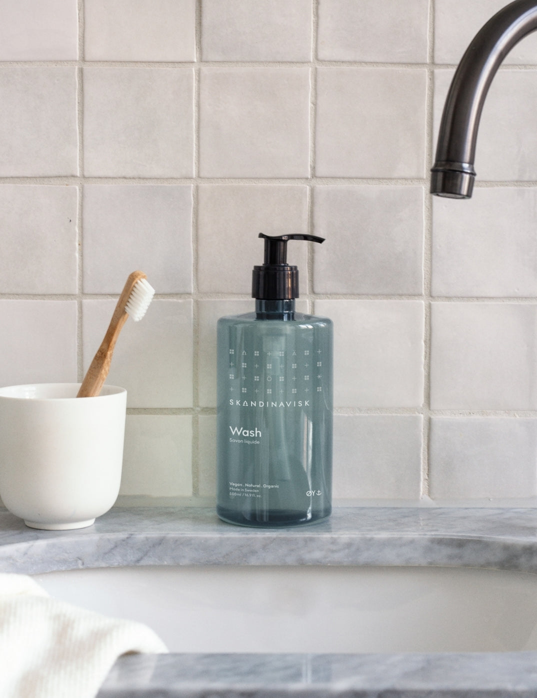 Sustainable, organic & vegan liquid soap and hand wash ØY, from Skandinavisk in new clear pale blue pump bottle