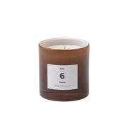 Pretty scented candle in soft toned glass jar for Nordic home style from Bloomingville