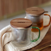 Teinfusionsmagasin i glas: bärnstensfärgat handtag