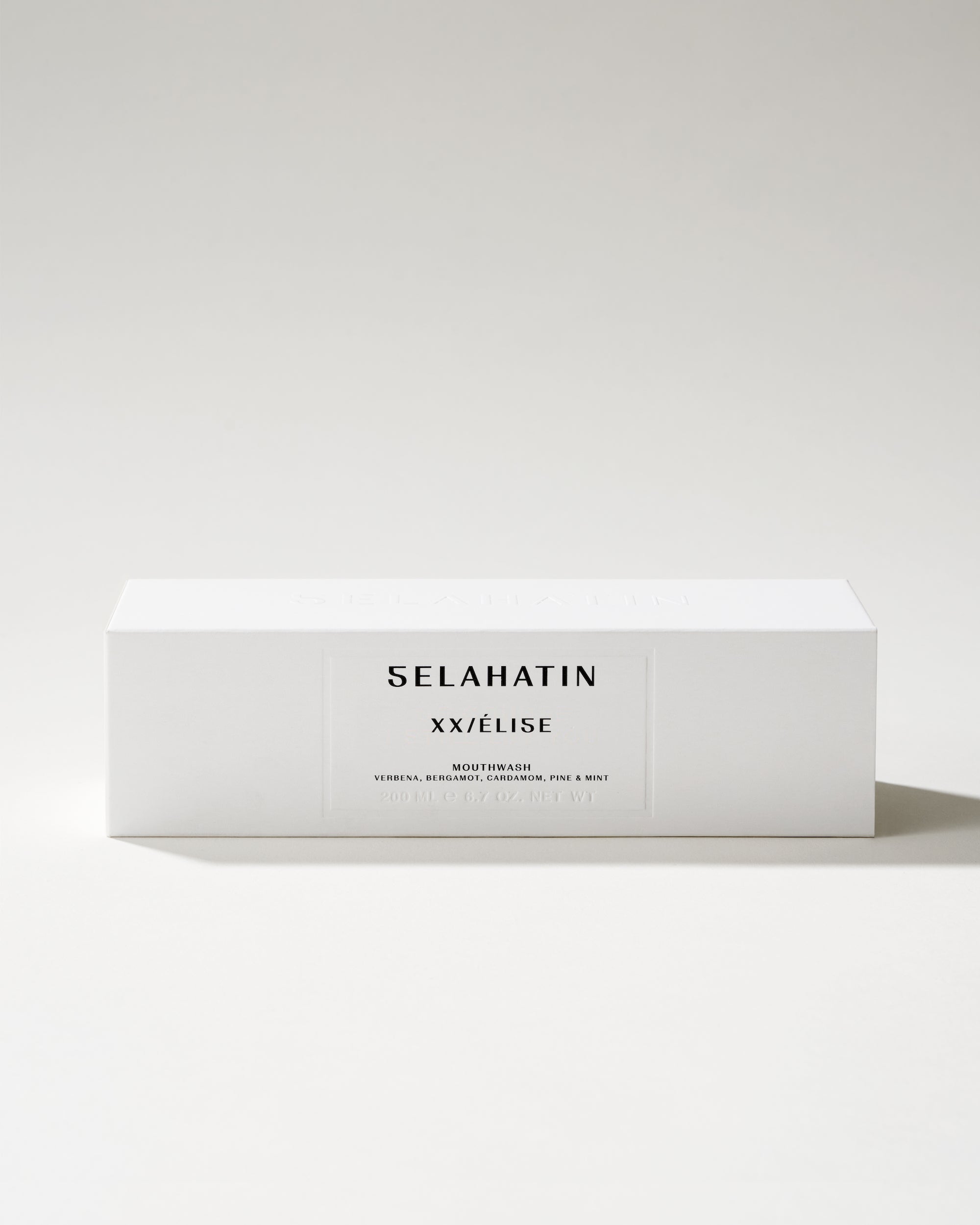 Élise from Selahatin, vegan, natural luxury mouthwash in stylish glass bottle & white gift packaging . Gift giving for someone who has everything & the design conscious bathroom.