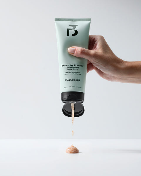 Bodyologist Everyday Polisher in a pale green soft touch tube with signature B logo, is an apricot kernel based body scrub, vitamin rich skincare for the body