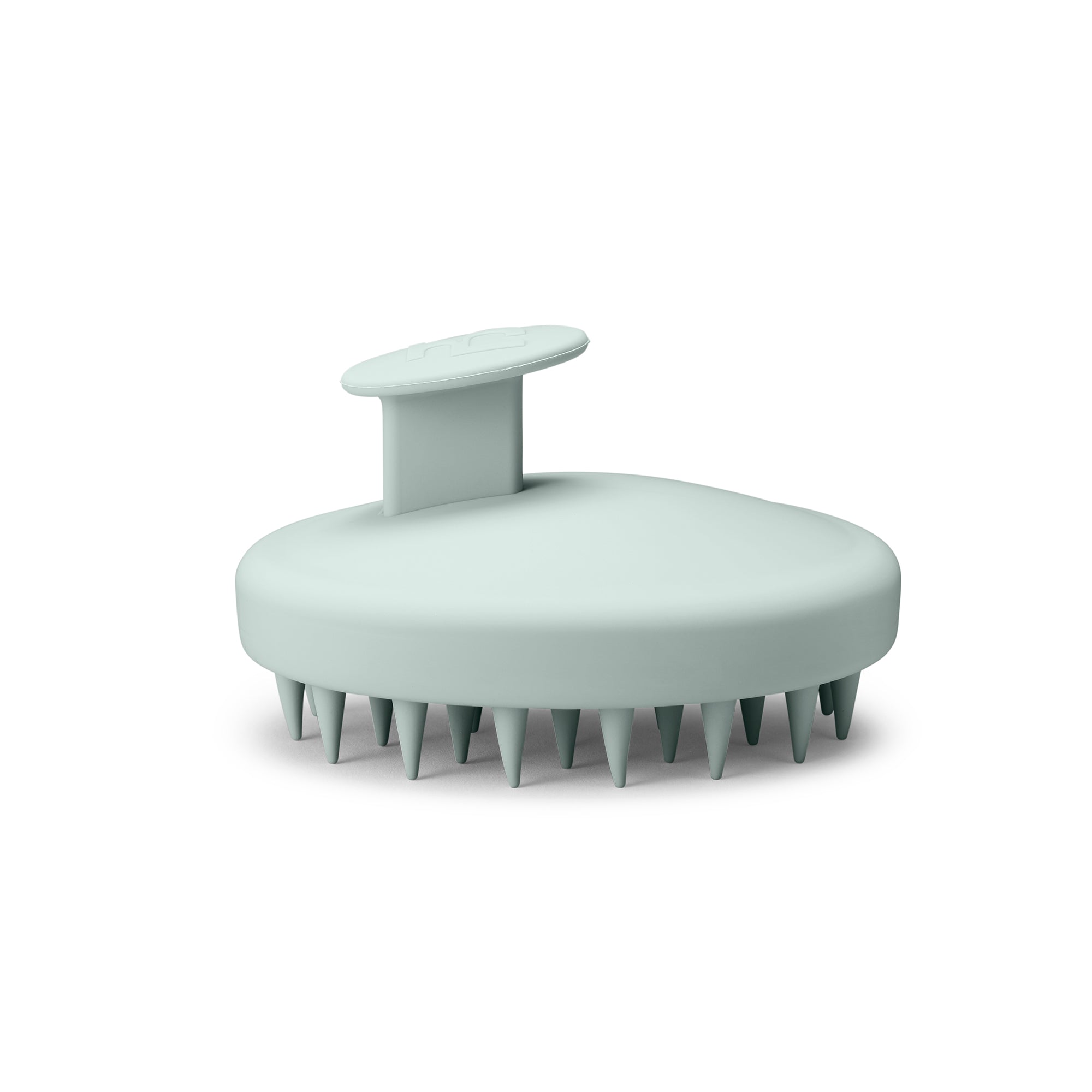 Bodyologist Stimulating Body Brush  in  pale green soft silicone with comfort handle and gentle spiky bristles gives you the best skincare for the body