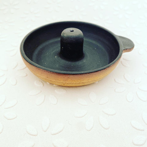 Unique, handmade exclusively for Bare Nordic Beauty, Skåne Ljus created a ceramic incense holder for incense sticks in local clay, glazed matt black on the inside with the outer left natural . with hand tag ash collector