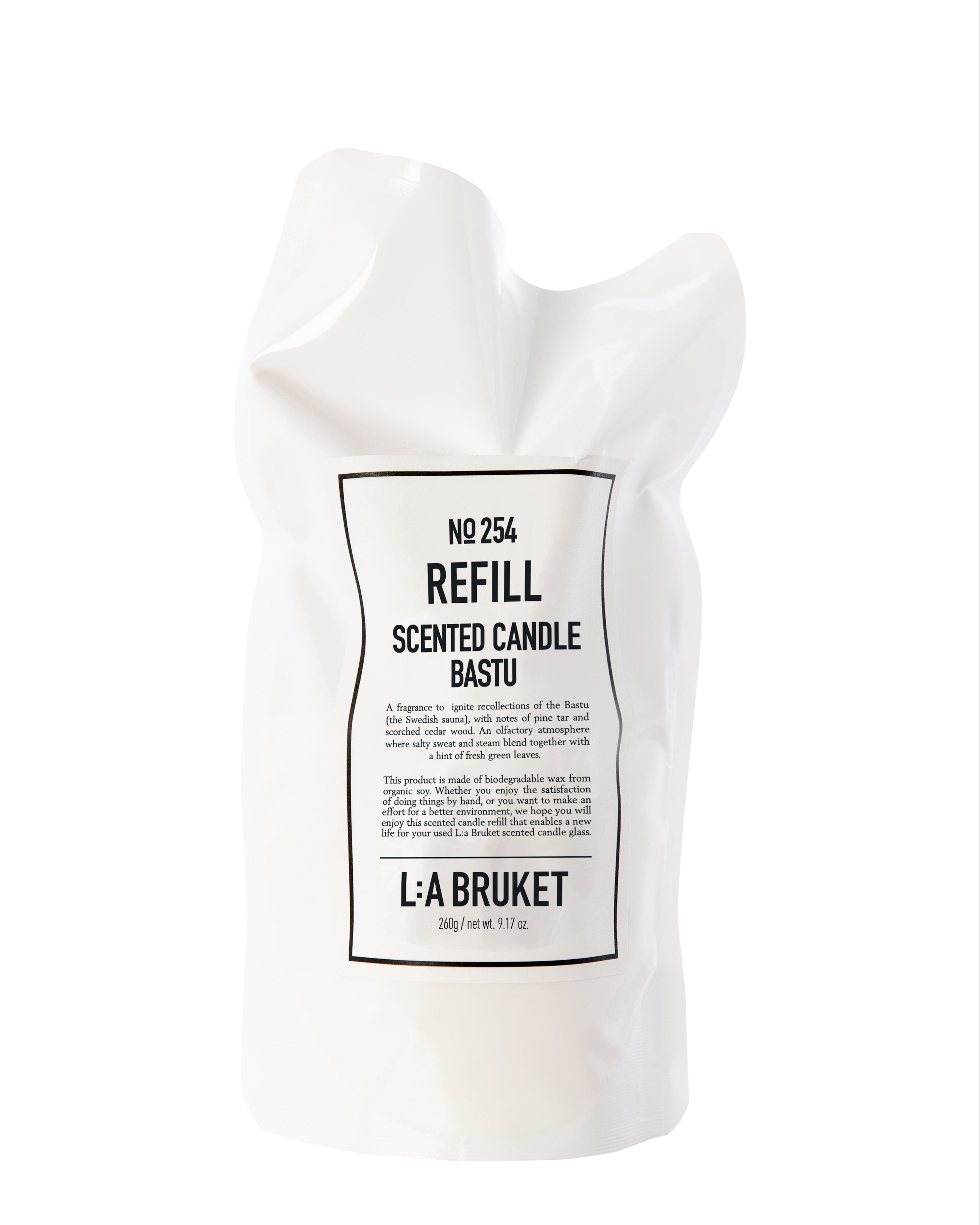 All natural, organic and vegan candle in sustainable refill pouch with the warm woody sauna scent Bastu from the best of Sweden's coastal home fragrance brand, L:A Bruket