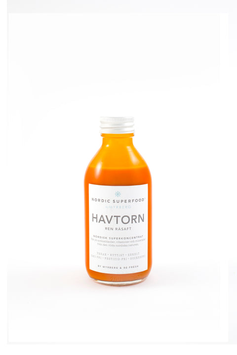 Glass bottle of pure, concentrated raw pressed sea buckthorn health shot from Nordic Superfoods