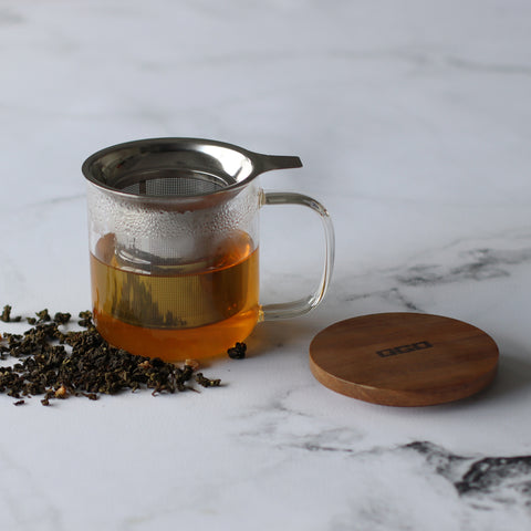 Borosilicate glass mug for infusions of tea for the best flavour and benefits due to its wide stainless steel mesh insert and natural wooden lid from OGO Living