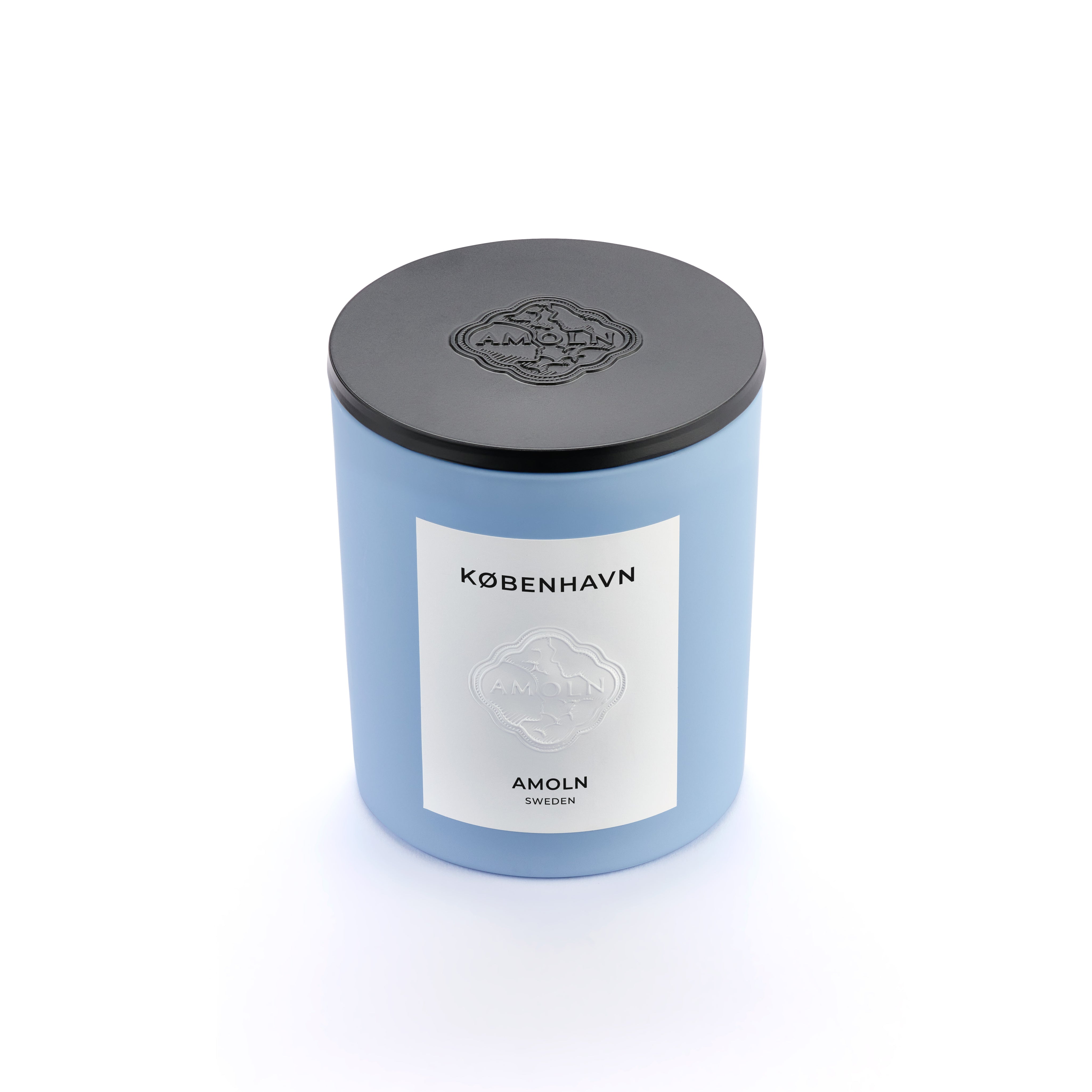 Signature blue candle in the same sky blue ceramic jar, inspired by Scandinavian skies, in the scent København - a blend of grapefruit, pepper, honey & musk from Amoln, makers of Sweden's royal candles.