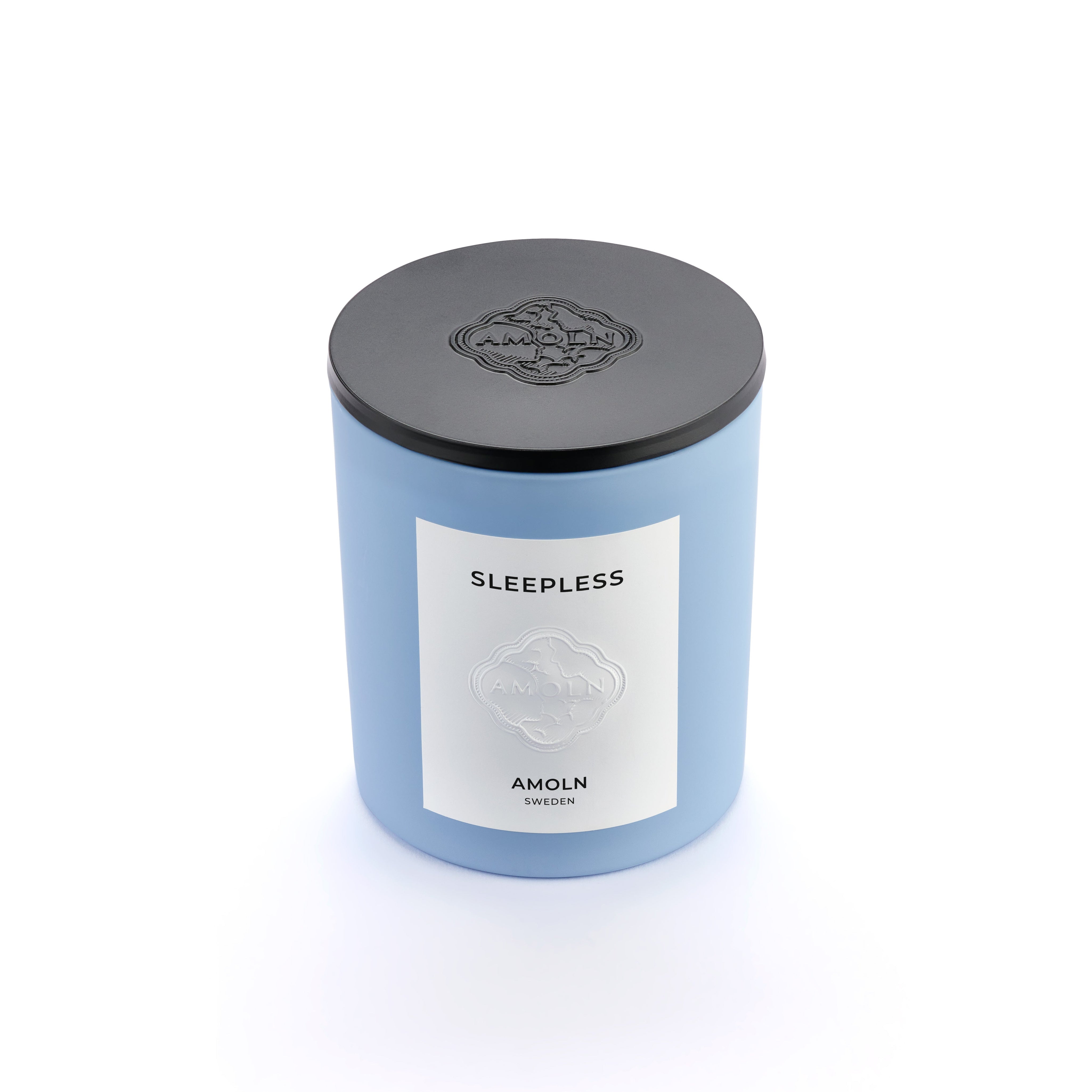 The solid black metal embossed candle lid protects Amoln’s monochromatic blue candles and preserves the scent