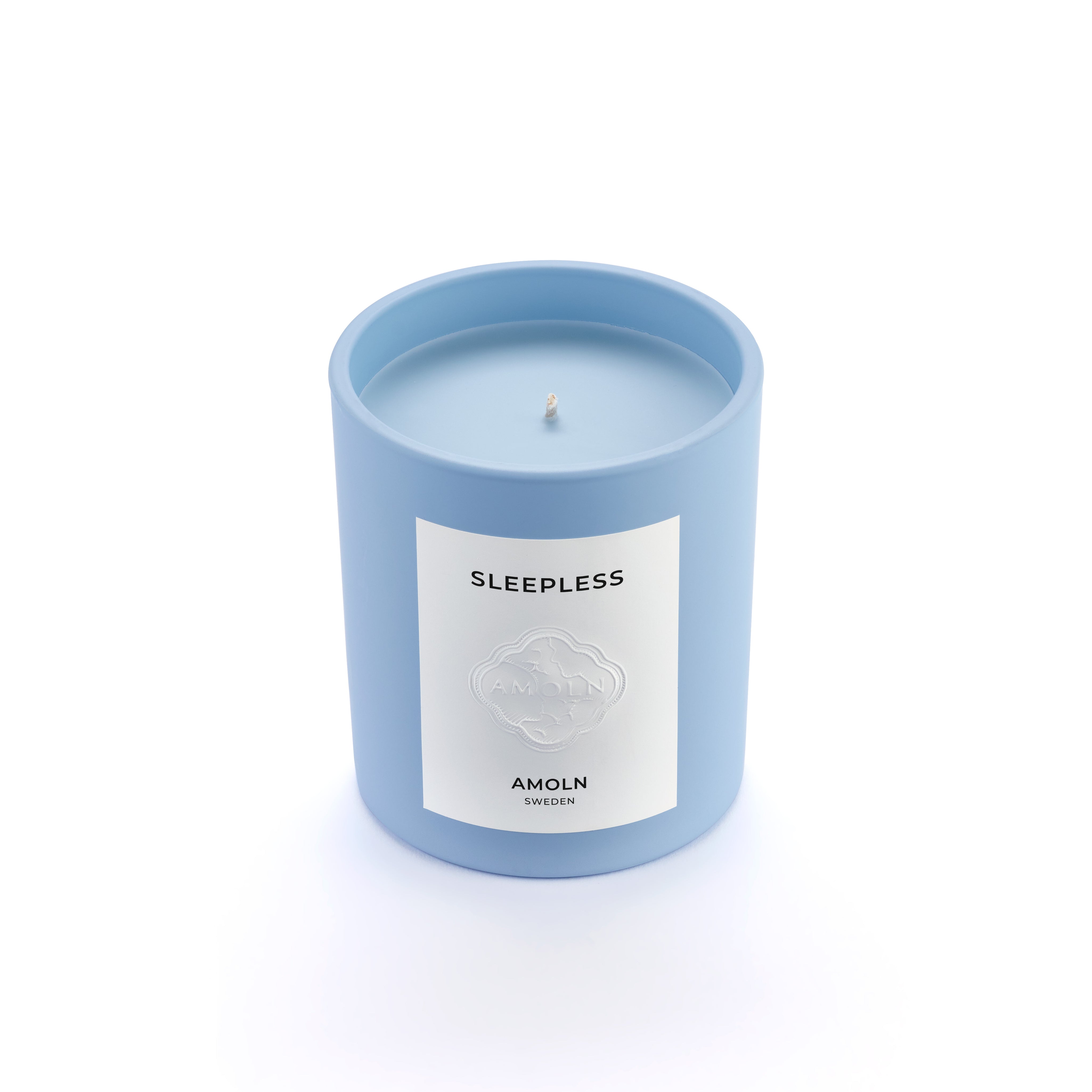 Signature blue candle in the same sky blue ceramic jar, inspired by Scandinavian skies, in the scent Sleepless - a blend of pear, lavender & sage & violet from Amoln, makers of Sweden's royal candles.