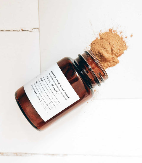 The brown glass jar with copper coloured lid contains a blend your own mask of French pink clay with fucus seaweed , by The Witchery CPH (8539683062065)