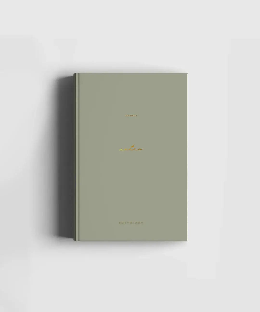 Soft touch green hard cover notebook with gold foil text 'My Daily Notes' with blank pages for notes, sketches, poems and more, produced sustainably by Cozy Publishing.