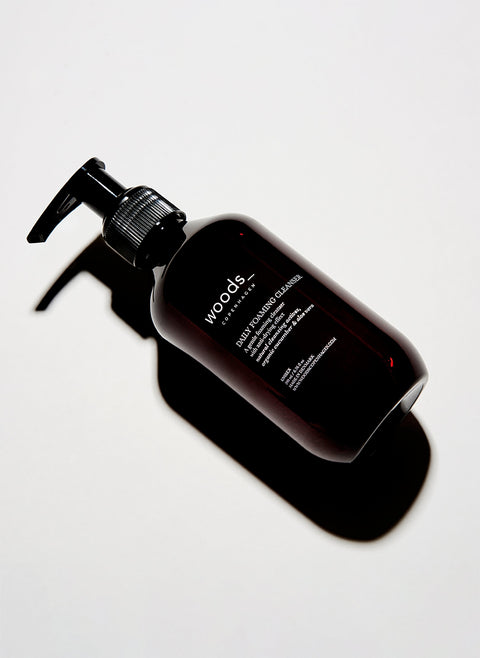 Brown pump bottle of with natural, organic vegan Daily Foaming Cleanser for all skins, unisex , made by Woods Copenhagen
