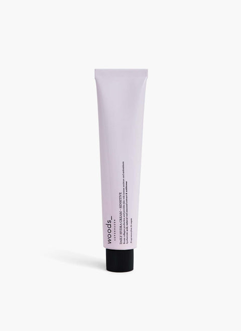 Pale lilac metal tube with natural, organic vegan Daily Hydra Cream, Sensitive, to moisturise all skins, unisex , made by Woods Copenhagen.