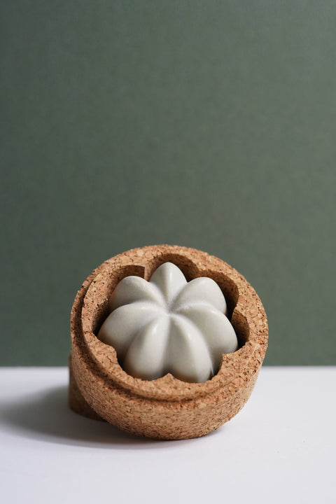 Pretty bars of solid shampoo in a cork travel case for conscious choices, with gentle effective cleansing by Umai, a pretty gift for an environmentally friendly choice.