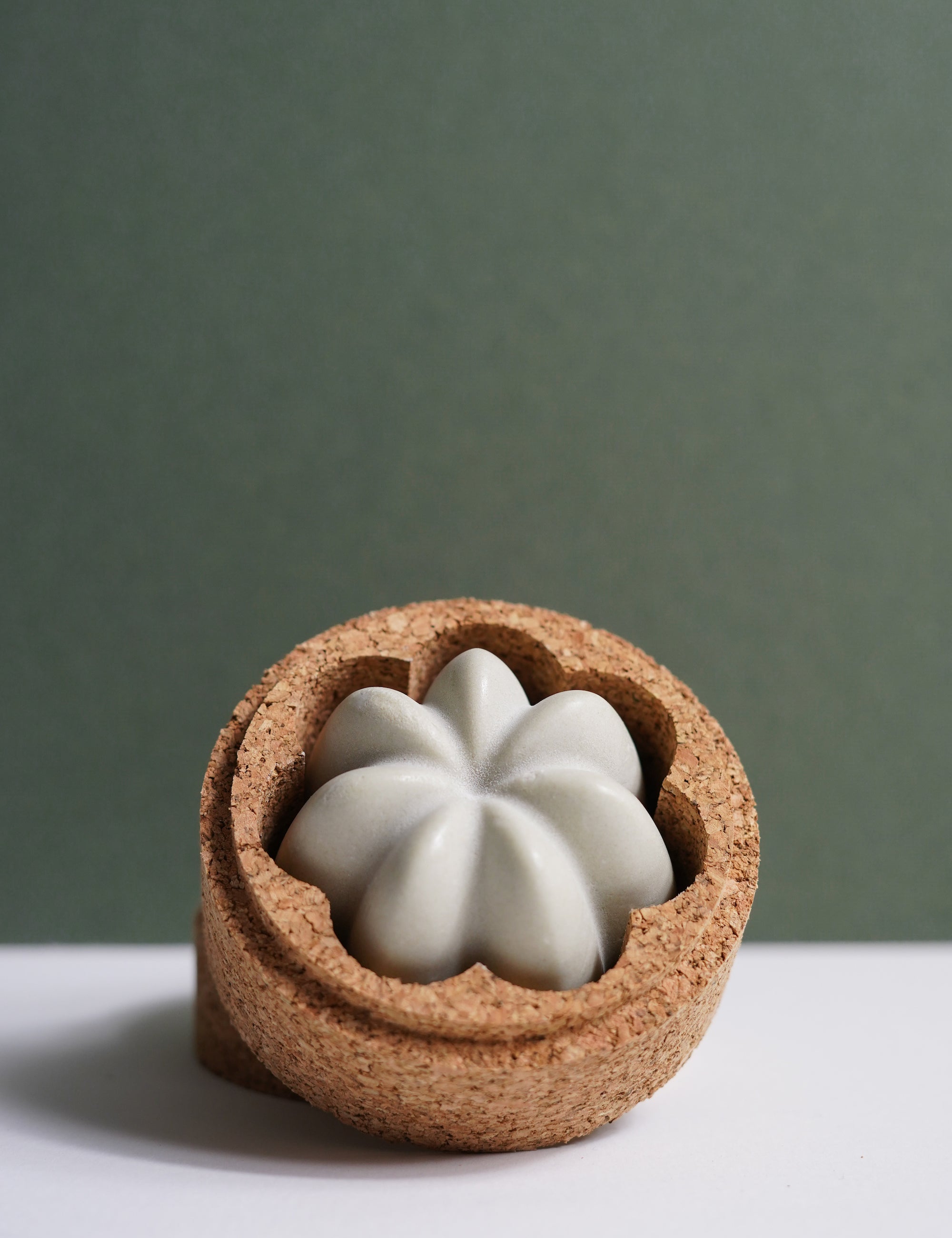 Pretty bars of solid shampoo in a cork travel case for conscious choices, with gentle effective cleansing by Umai, a pretty gift for an environmentally friendly choice.