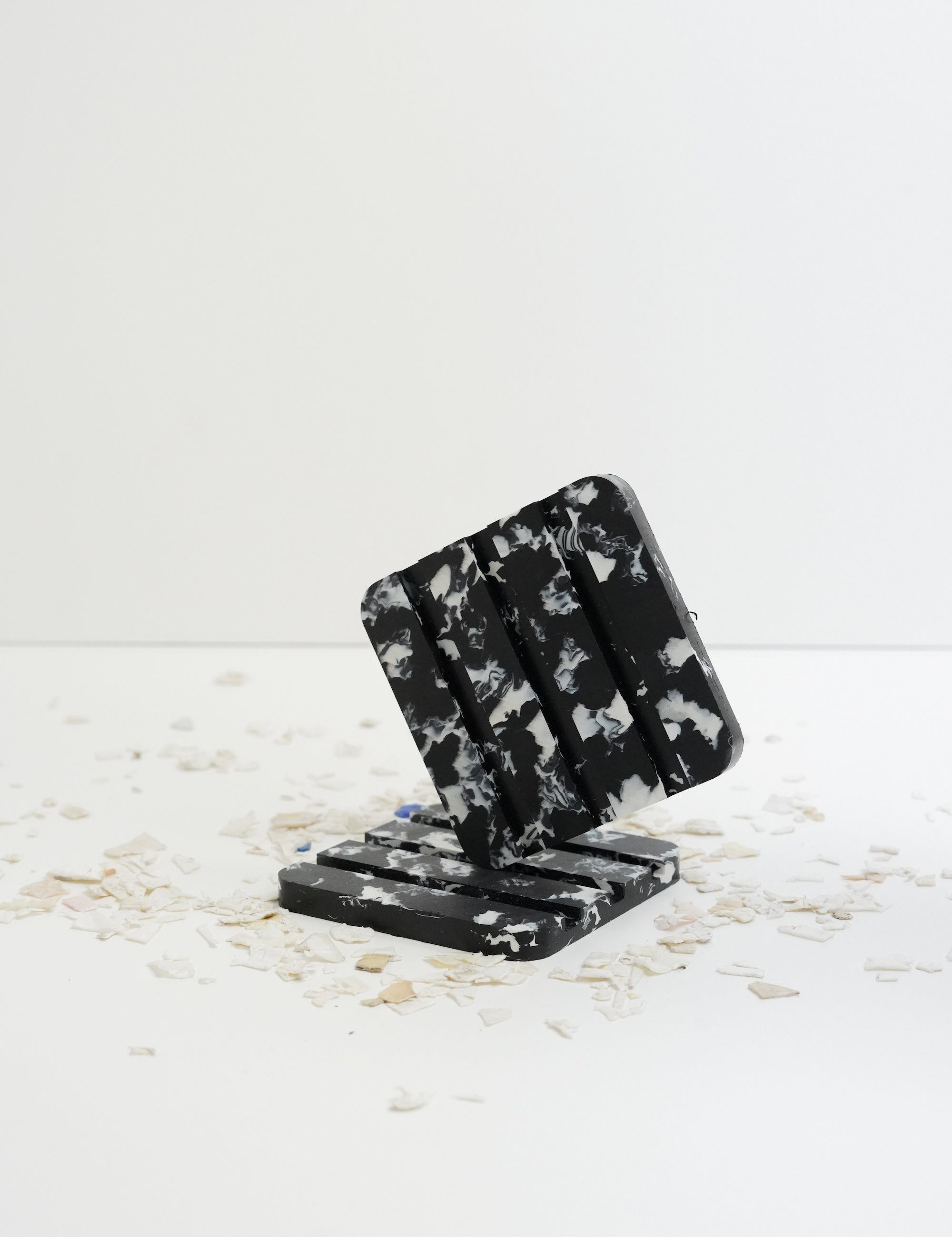 Made from recycled ocean plastic this stylish and sustainable soap dish is perfect for solid shampoo bars or any regular bar of soap, stylish in speckled black with white flecks and safe for the bathroom, made by Umai