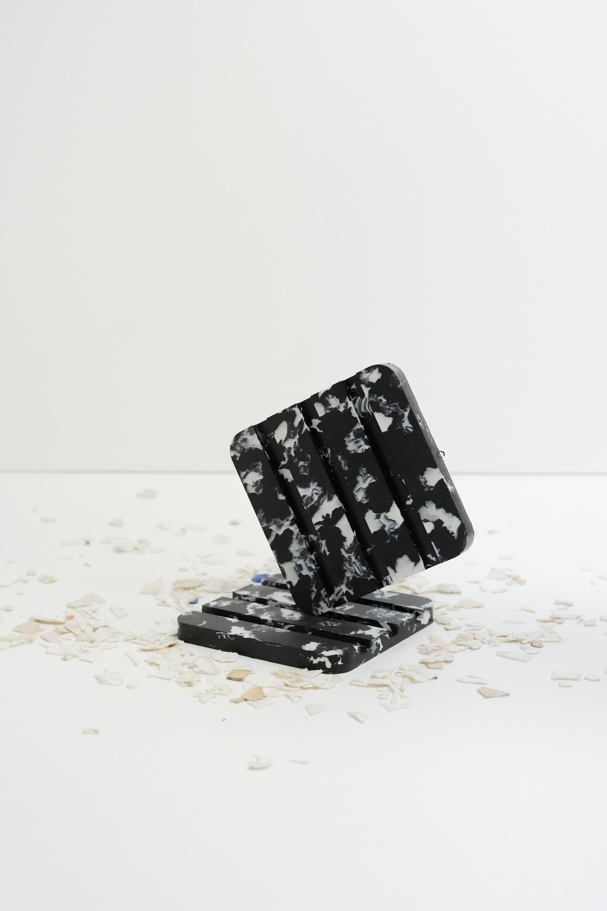 Made from recycled ocean plastic this stylish and sustainable soap dish is perfect for solid shampoo bars or any regular bar of soap, stylish in speckled black with white flecks and safe for the bathroom, made by Umai