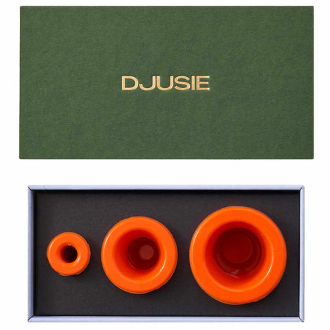 Orange silicone cups for facial cupping to aid drainage and skin tone, i n a green gift box from Djusie, Finland's leading organic skincare brand