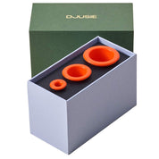 Orange silicone cups for facial cupping to aid drainage and skin tone, i n a green gift box from Djusie, Finland's leading organic skincare brand