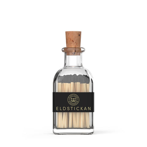 Black coloured matches in a stylish glass bottle from Eldstickan for a great interior design idea