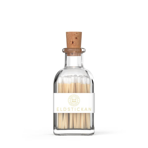 White coloured matches in a stylish glass bottle from Eldstickan for a great interior design idea